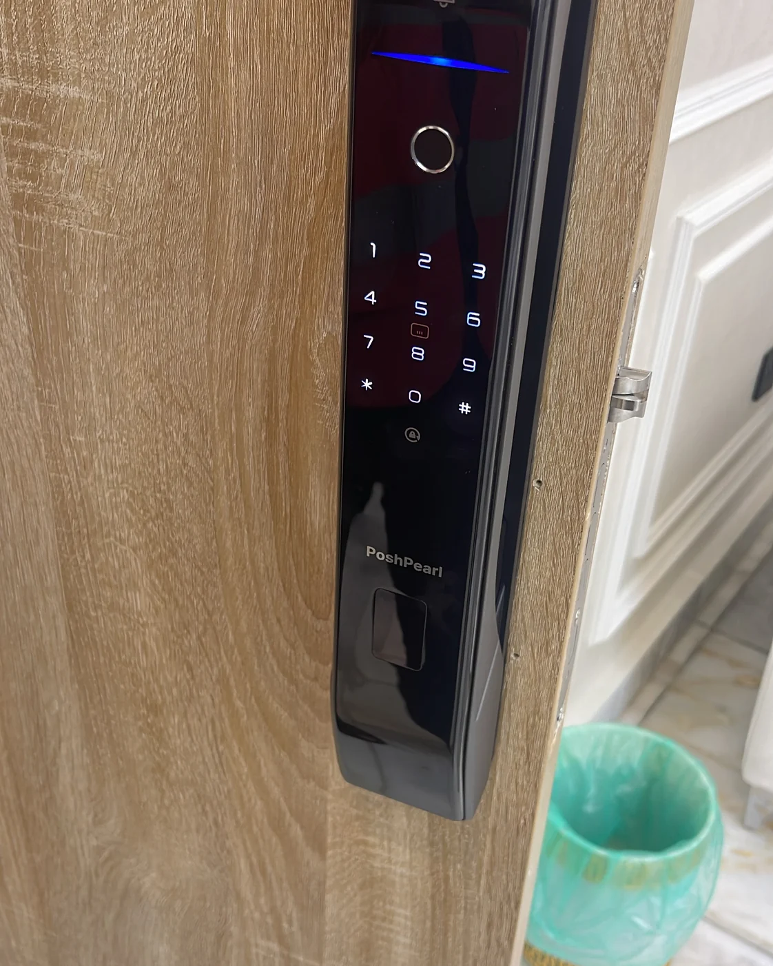 Black smart lock professionally installed on a clean modern door